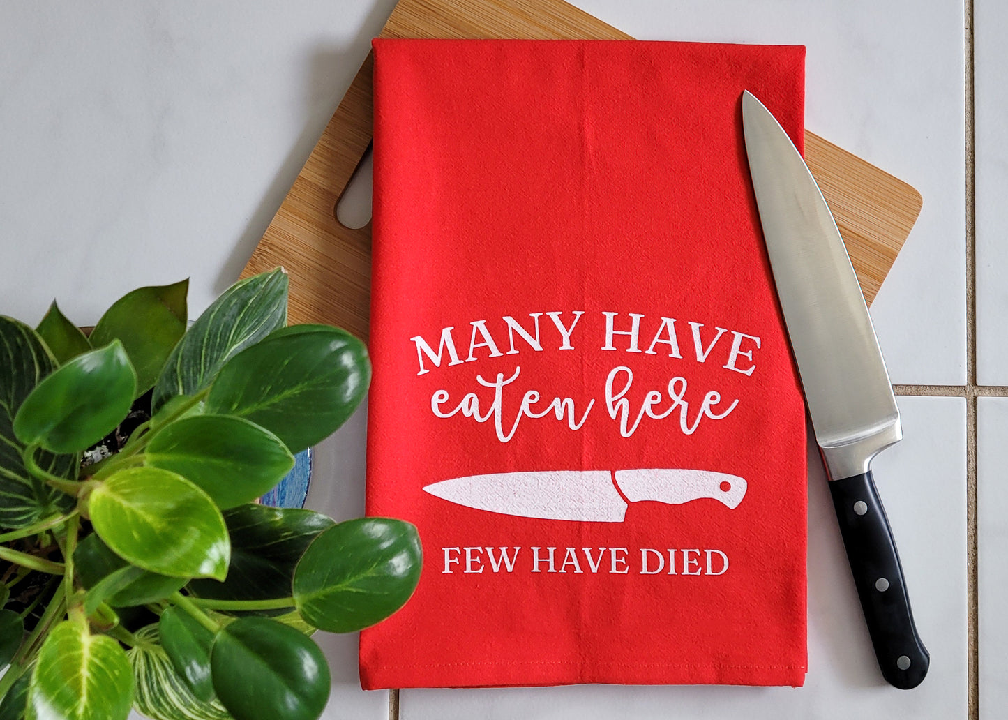 Many Have Eaten Here, Few Have Died Tea Towel - Red