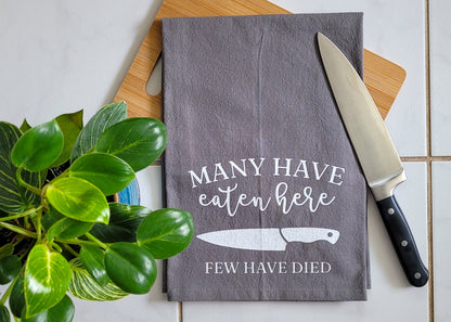 Many Have Eaten Here, Few Have Died Tea Towel - Gray