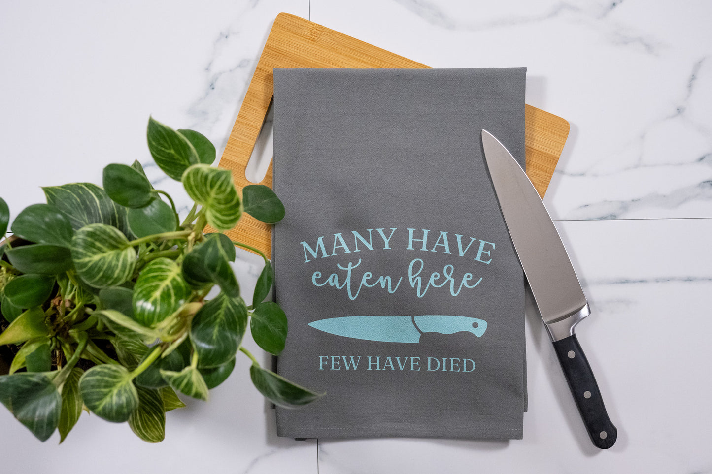 Many Have Eaten Here, Few Have Died Gray Tea Towel with Mint Ink
