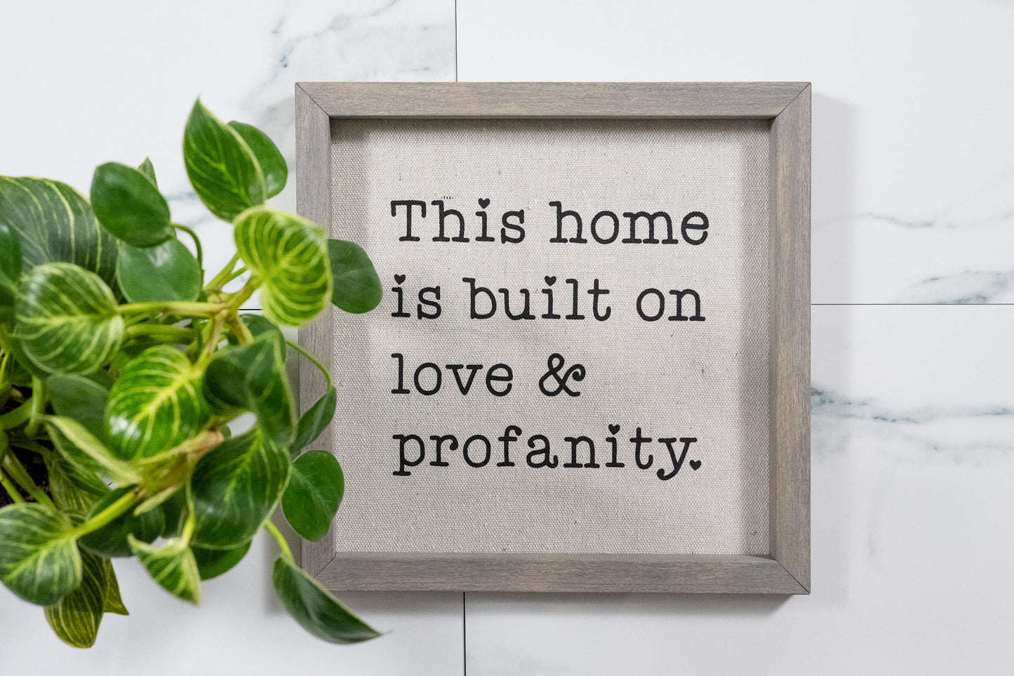This Home is Build on Love & Profanity Sign with Weathered Gray Frame and Black Ink