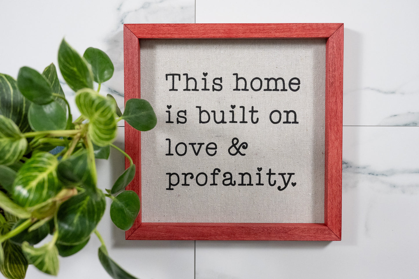 This Home is Build on Love & Profanity Sign with Barn Red Frame and Black Ink