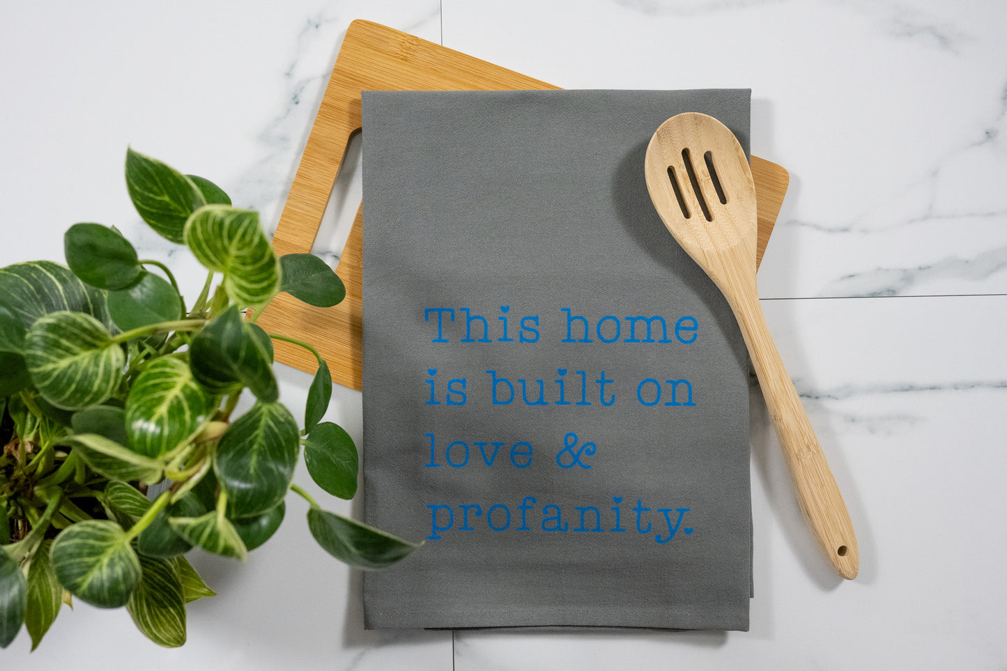 This Home Is Built On Love & Profanity Gray Tea Towel with Electric Blue Ink