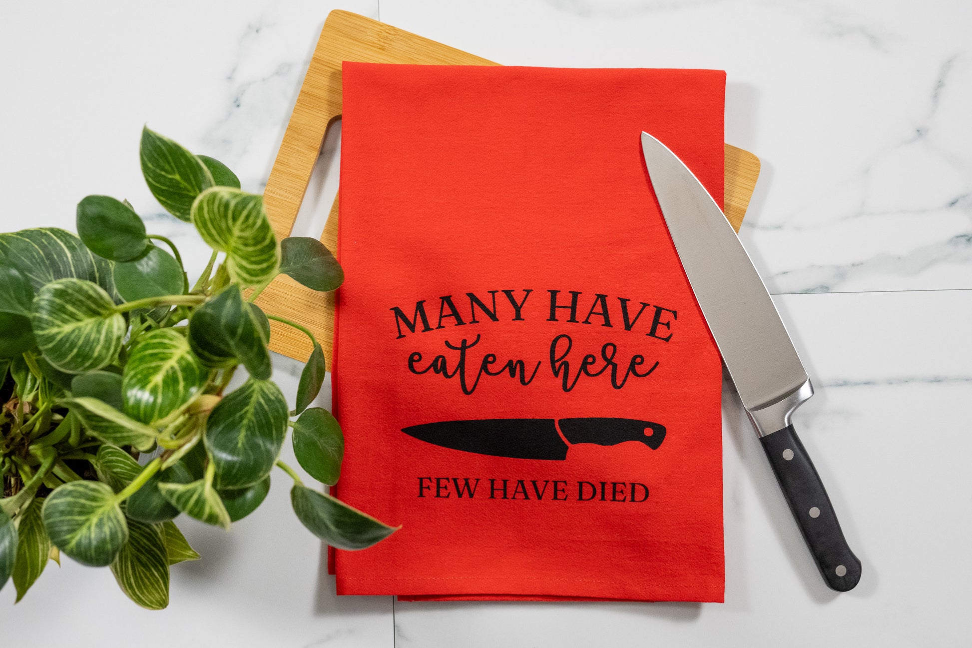 Many Have Eaten Here, Few Have Died Red Tea Towel with Black Ink