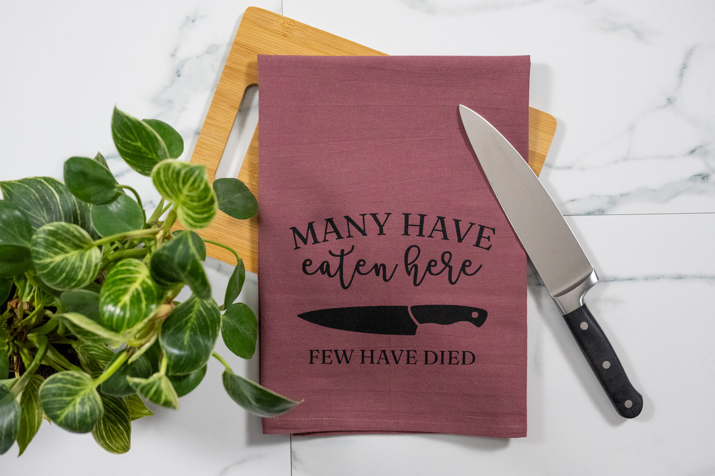 Many Have Eaten Here, Few Have Died Wine Tea Towel with Black Ink