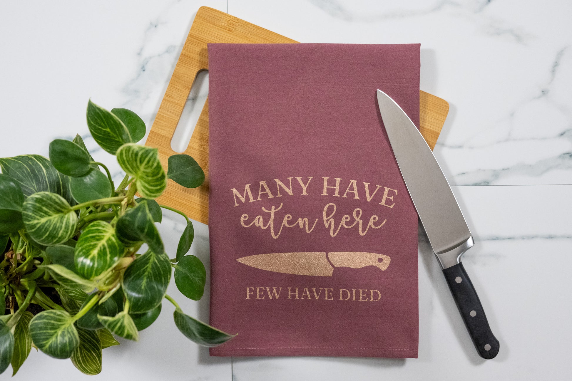 Many Have Eaten Here, Few Have Died Wine Tea Towel with Rose Gold Ink