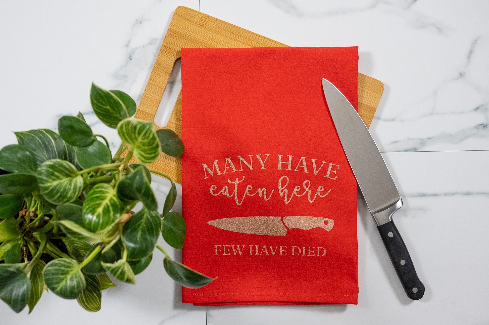 Many Have Eaten Here, Few Have Died Red Tea Towel with Rose Gold Ink