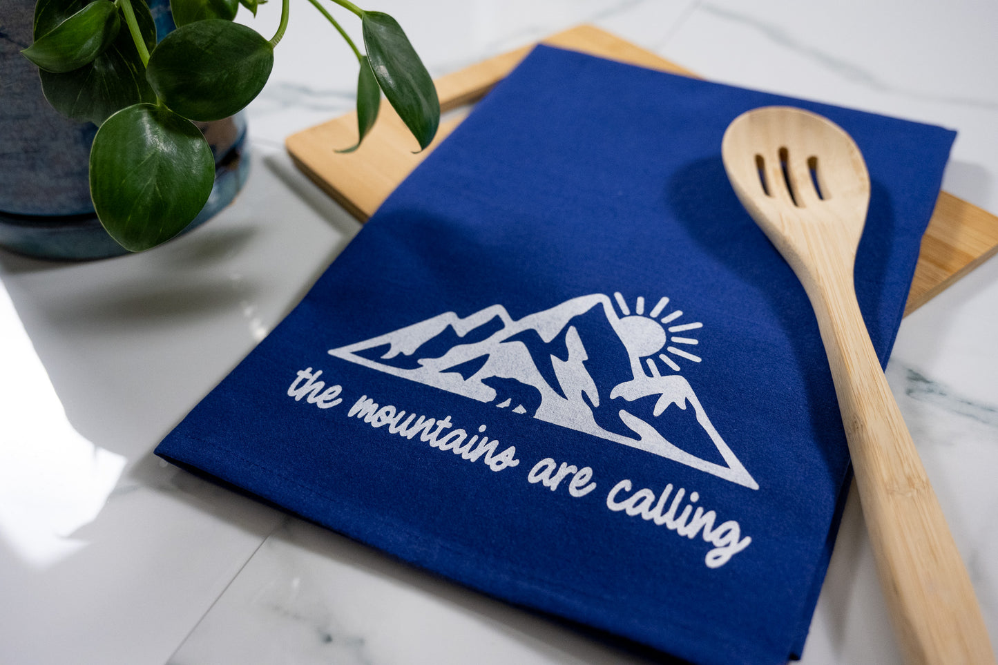 The Mountains Are Calling Blue Tea Towel with White Ink