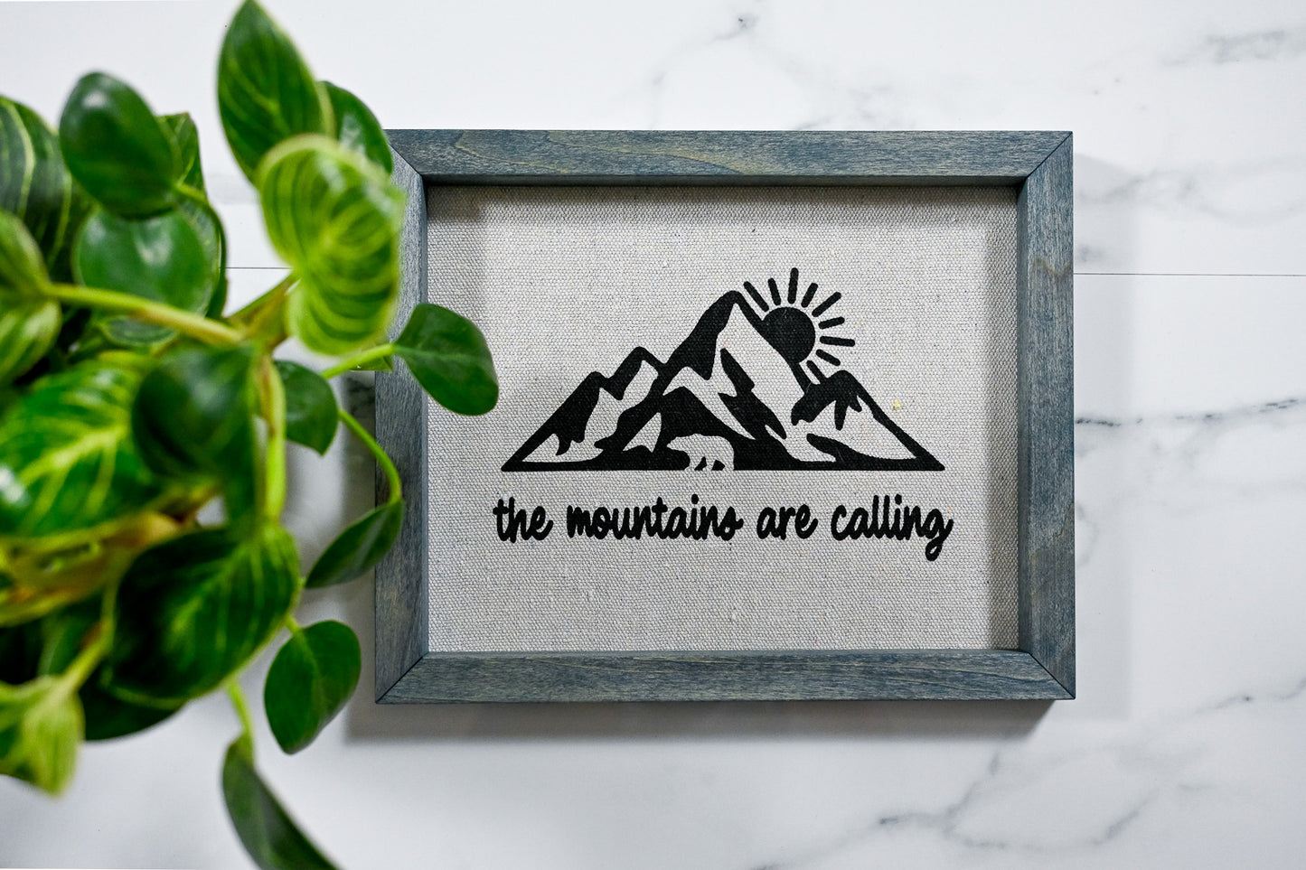 The Mountains Are Calling Reverse Canvas Sign with Worn Navy Frame